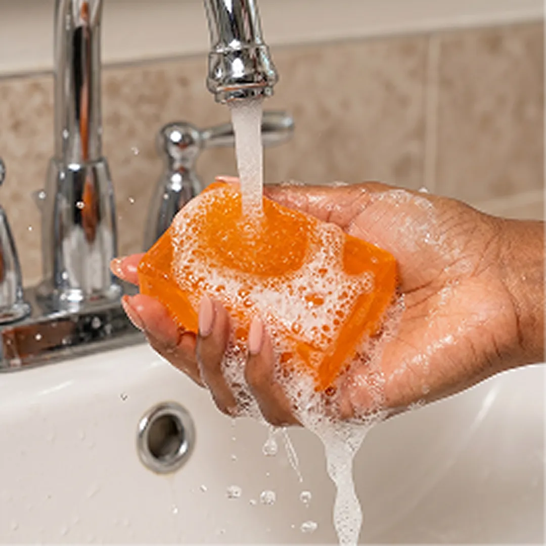 Lathering the soap with the bath net